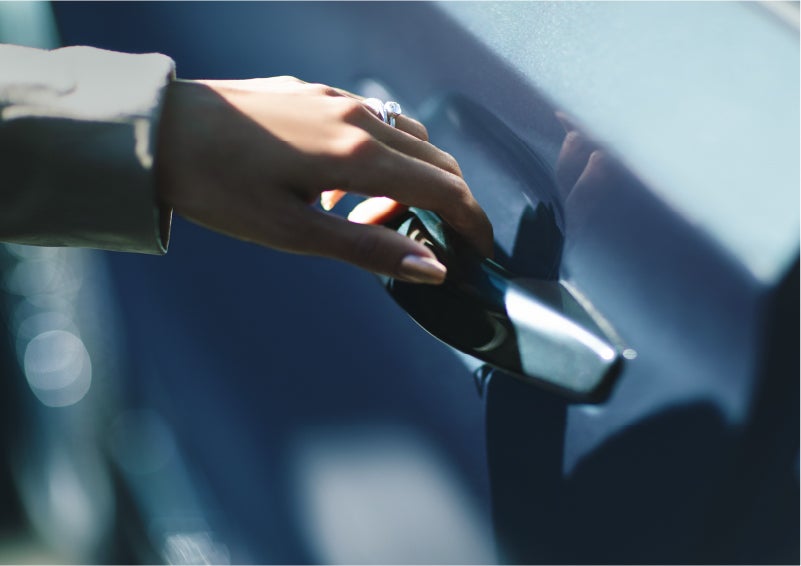 A hand gracefully grips the Light Touch Handle of a 2023 Lincoln Aviator® SUV to demonstrate its ease of use | Star Lincoln in Southfield MI