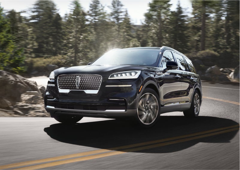 A Lincoln Aviator® SUV is being driven on a winding mountain road | Star Lincoln in Southfield MI