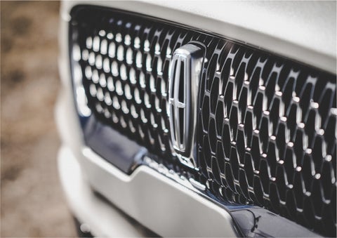 The grille of the 2023 Lincoln Aviator® Reserve model with an eye-catching repeated field of Lincoln Star logo shapes | Star Lincoln in Southfield MI