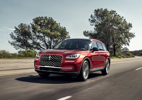 A 2023 Lincoln Corsair® SUV is shown being driven on a country road. | Star Lincoln in Southfield MI