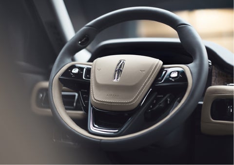 The intuitively placed controls of the steering wheel on a 2023 Lincoln Aviator® SUV | Star Lincoln in Southfield MI