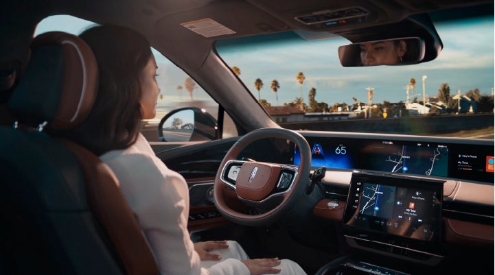 A person is shown driving hands-free on the highway with available Lincoln BlueCruise technology. | Star Lincoln in Southfield MI
