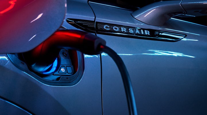 A charger plugged into the charging port of a 2024 Lincoln Corsair® Plug-in Hybrid model. | Star Lincoln in Southfield MI