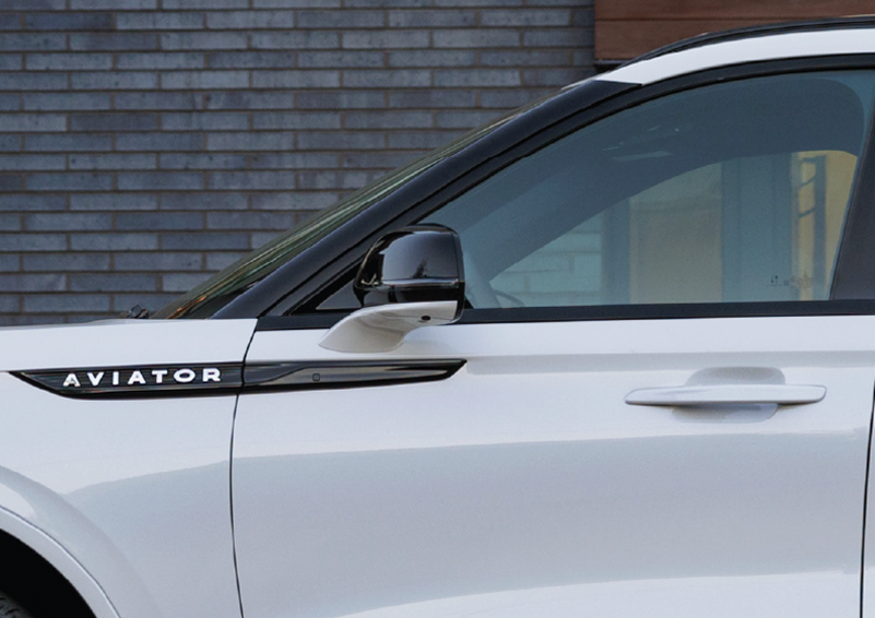 The driver’s door of a white 2025 Lincoln Aviator® SUV is showcased. | Star Lincoln in Southfield MI