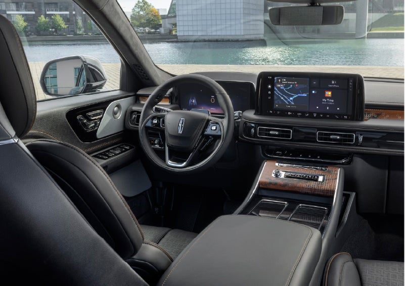 The interior of the 2026 Lincoln Aviator® SUV is shown parked with a view of a harbor through the windshield. | Star Lincoln in Southfield MI