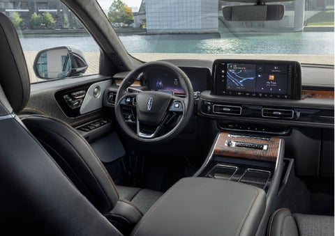 The interior of the 2026 Lincoln Aviator® SUV is shown parked with a view of a harbor through the windshield. | Star Lincoln in Southfield MI