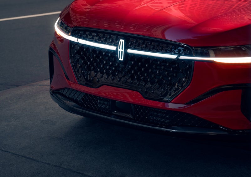 The available front LED light bar and center Lincoln Star logo glow at dusk. | Star Lincoln in Southfield MI