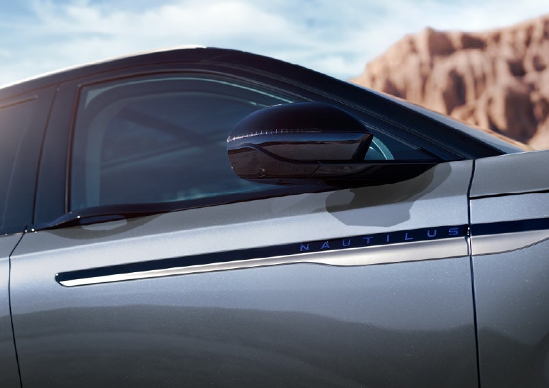 Blue lettering on the side of the vehicle that reads Nautilus indicates the available Hybrid Powertrain. | Star Lincoln in Southfield MI